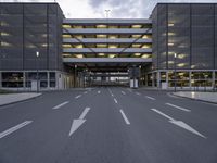 the car park is empty and empty at dusk as a traffic light is set on