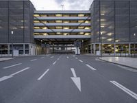 the car park is empty and empty at dusk as a traffic light is set on