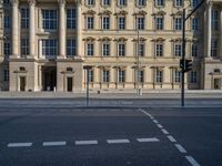 two lanes that appear to be in the middle of the road, and are straight lines to the left