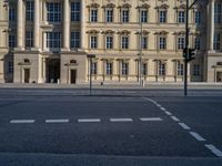 two lanes that appear to be in the middle of the road, and are straight lines to the left