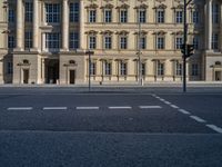 two lanes that appear to be in the middle of the road, and are straight lines to the left