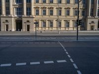 two lanes that appear to be in the middle of the road, and are straight lines to the left