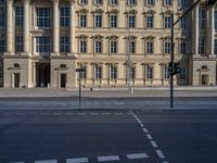 two lanes that appear to be in the middle of the road, and are straight lines to the left