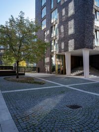 the building is made up of three stories and two floors, with cobblestone roads at their edges and bricked floors