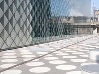there is a very large building with polka dots all over it's surface and architecture