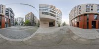 two panoramas with one photo of buildings in the middle of the picture and the other a picture of an oval building