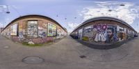 two spherical photos of a building with graffiti on it and the view up in the side