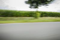 German Landscape: Road with Asphalt under a Cloudy Sky