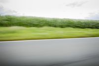 German Landscape: Road with Asphalt under a Cloudy Sky