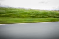 German Landscape: Road with Asphalt under a Cloudy Sky