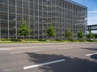 the building has several sections of glass covering it in a mesh screen of windows and mesh of lattice