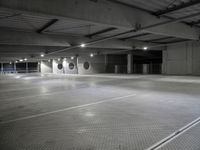 a building with three empty parking spaces with one person walking in the garage area in front of it