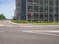 there are three signs next to a road that is wide enough for traffic to cross