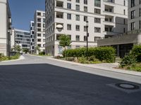 the street is paved in a paved area that separates two buildings next to each other