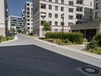 the street is paved in a paved area that separates two buildings next to each other