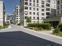 the street is paved in a paved area that separates two buildings next to each other