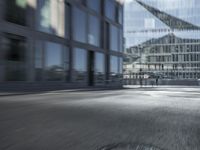 an blurry image of a man walking down a street carrying his bike in hand