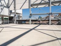 the large parking lot in front of a stadium has many stairs and green numbers on it