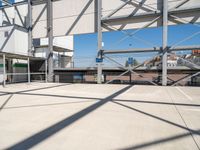 the large parking lot in front of a stadium has many stairs and green numbers on it