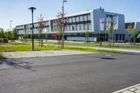 an empty street and an office building in the distance on a clear day in europe