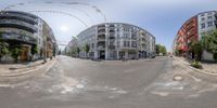 a view of the outside of a city street in a panoramic lens with buildings in the background