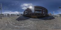 360 - lensing of the front of a modern apartment building in an open space