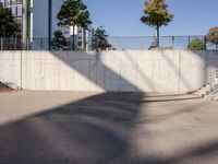 a man riding a skateboard up the side of a ramp while holding onto a bag