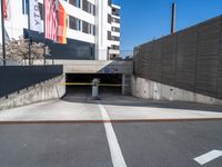 a parking garage with a concrete wall and street scene in the background for an article on how to avoid car bumps