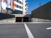 a parking garage with a concrete wall and street scene in the background for an article on how to avoid car bumps