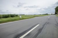 Road in Germany: A View of Asphalt and Clouds