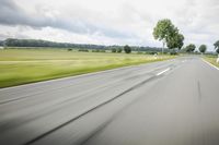 Road in Germany: A View of Asphalt and Clouds