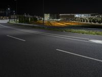 there is a empty street with no one on it at night on a clear day