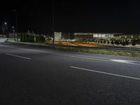 there is a empty street with no one on it at night on a clear day