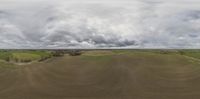 view of the fields as viewed by a fisheye lens on a cloudy day with overcast skies