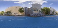 360 - vr street art, showing a school building in the distance, and a road leading to it