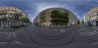 a photo looking up a street at multiple buildings on either sides of the street,