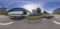 the panoramic picture of an intersection at a highway crossing in an urban area