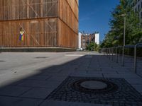 a group of people riding skateboards near wooden panels and stairss with artwork on them