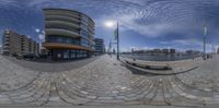 an image of a building that is taken in this 360 - shot mirror picture of a street