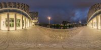 two circular views looking up a path with a building in the background and street lights to the right