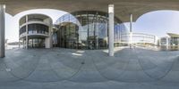 the reflection on the side of the building shows off some circular shapes in front of it