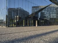 modern glass buildings reflecting in an open courtyard of an office complex of an architectural city