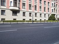 this is an outdoor shot of the building in front of it, along the street