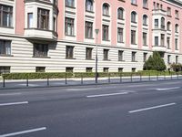 this is an outdoor shot of the building in front of it, along the street