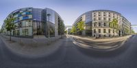 this is a photograph of two buildings taken from a fish eye lens on a cloudy day