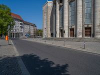 an entrance of a building with large columns and doors that spell out the word voltege