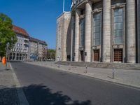 an entrance of a building with large columns and doors that spell out the word voltege