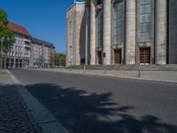 an entrance of a building with large columns and doors that spell out the word voltege