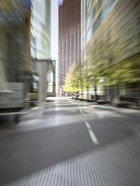 motion blurred image of traffic on city street in the day time scene of urban area