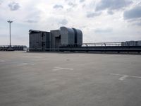 a boat is parked in an empty parking lot near an air port on the water